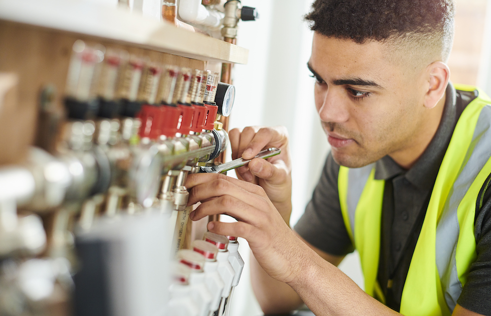 Air source heating engineer at work 